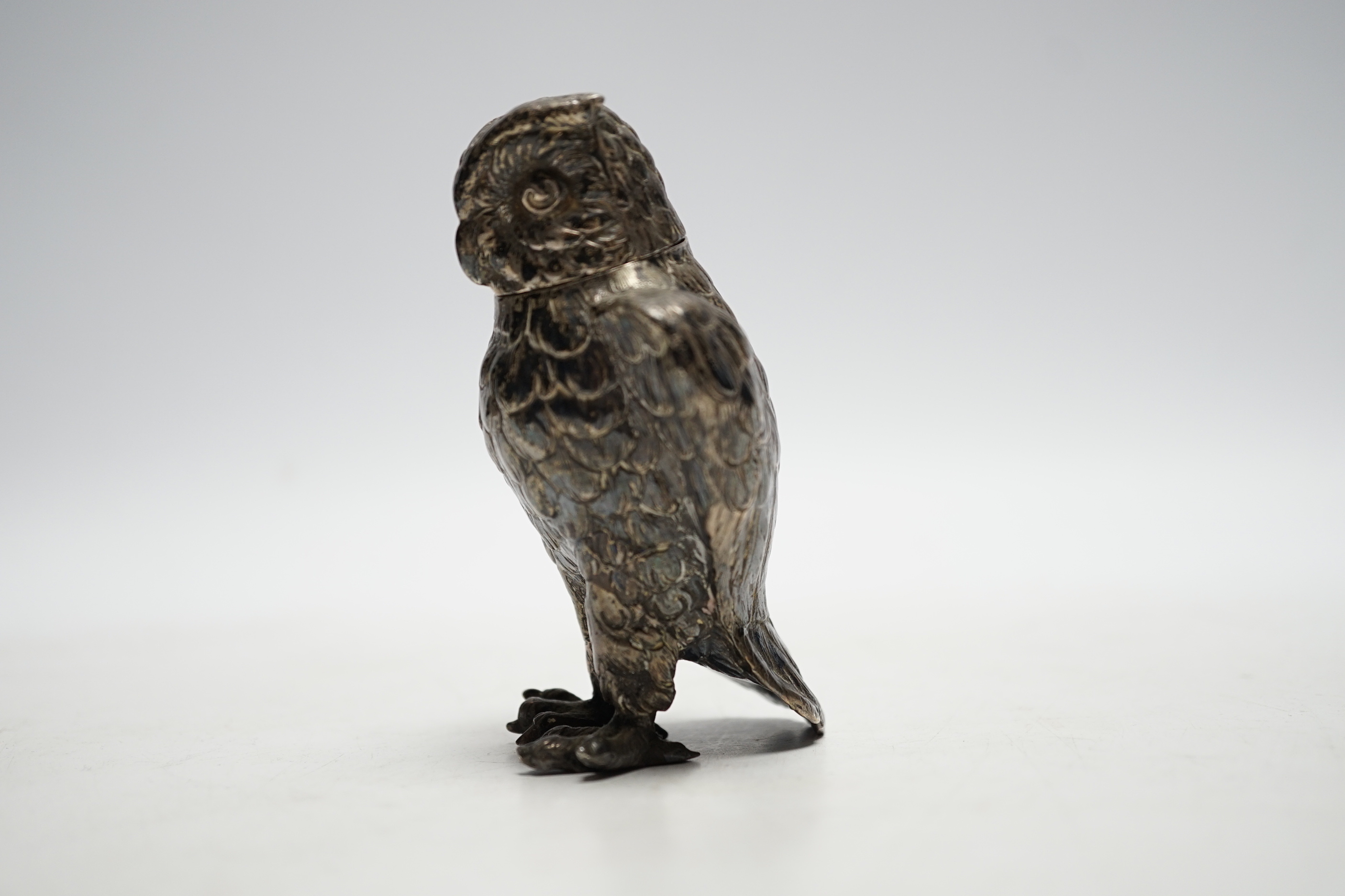 A late 19th/early 20th century novelty silver pepperette, modelled as an owl, import marks for Berthold Muller, London, no date letter, 93mm.